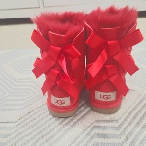 Cherry red Ugg kids boot with bow detail. Size 9